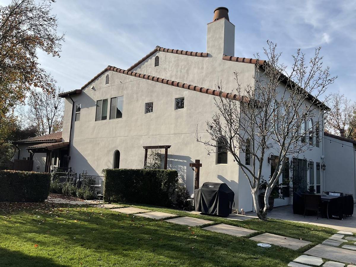 After: the same home painted white