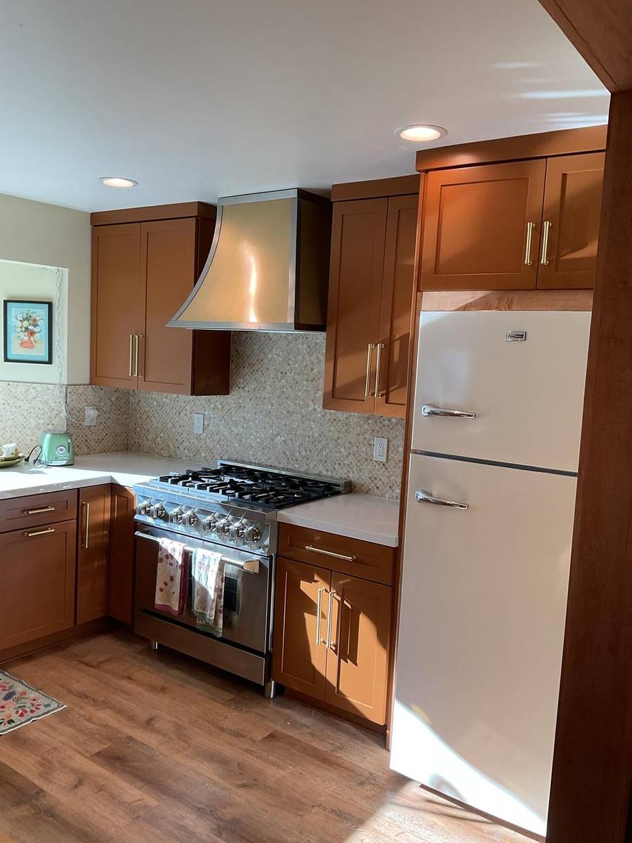 Kitchen with warm stained cabinets